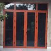 Mẫu cửa nhôm việt pháp vân gỗ mở quay 4 cánh mặt tiền nhà đẹp